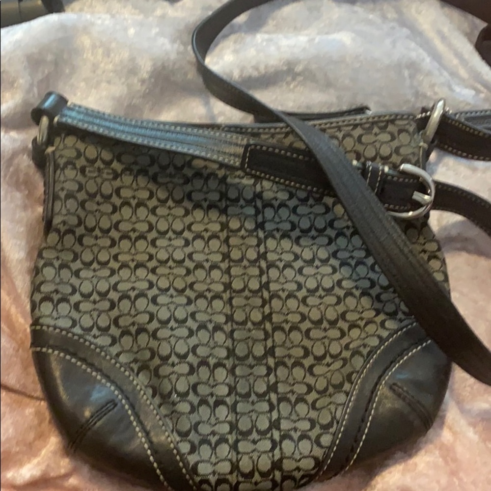 Black cross body Coach purse.